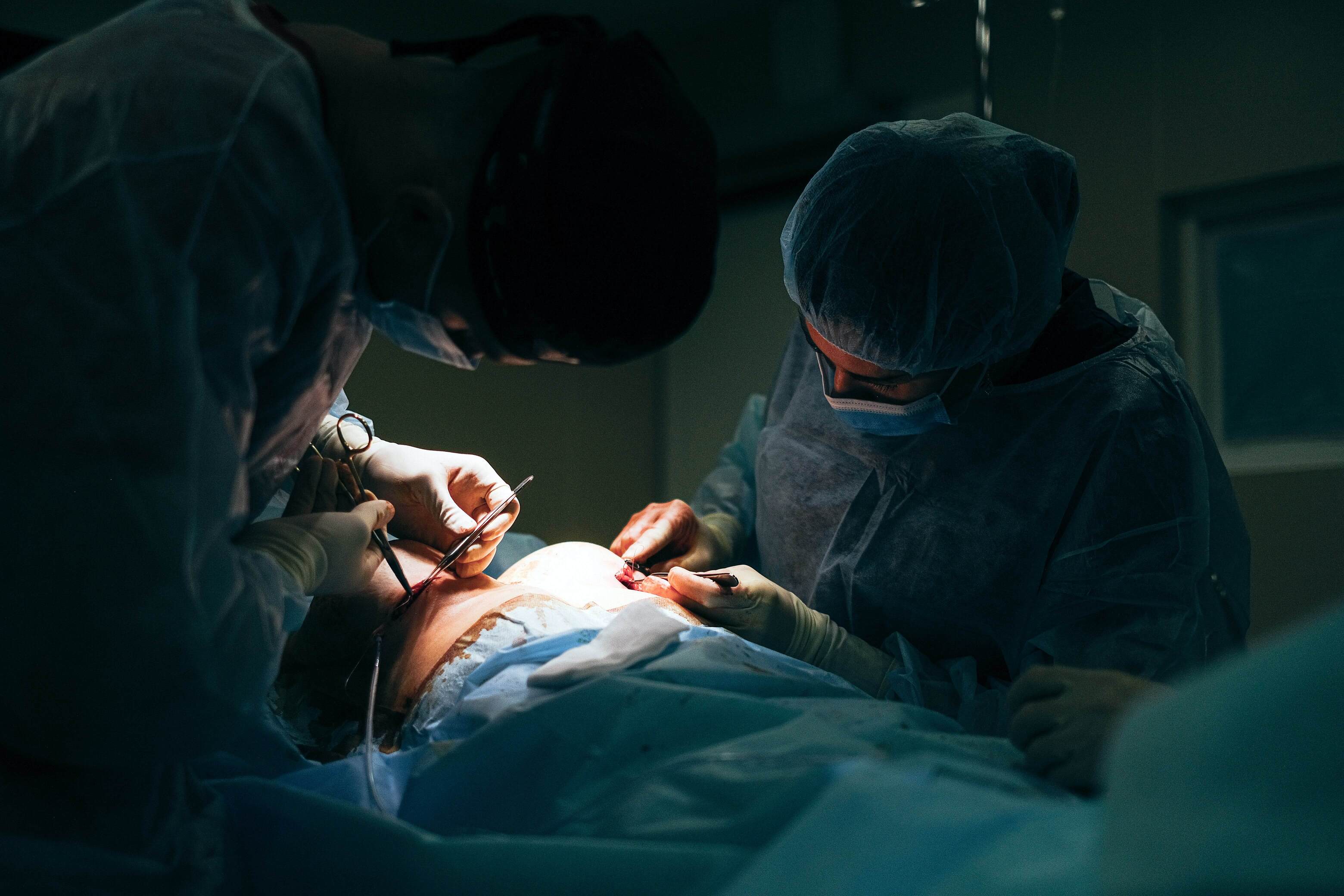 Group Surgeons Performing Minimally Invasive Surgery Patient's Anus Using  Surgical Stock Photo by ©e.a.nekrasov 364643354